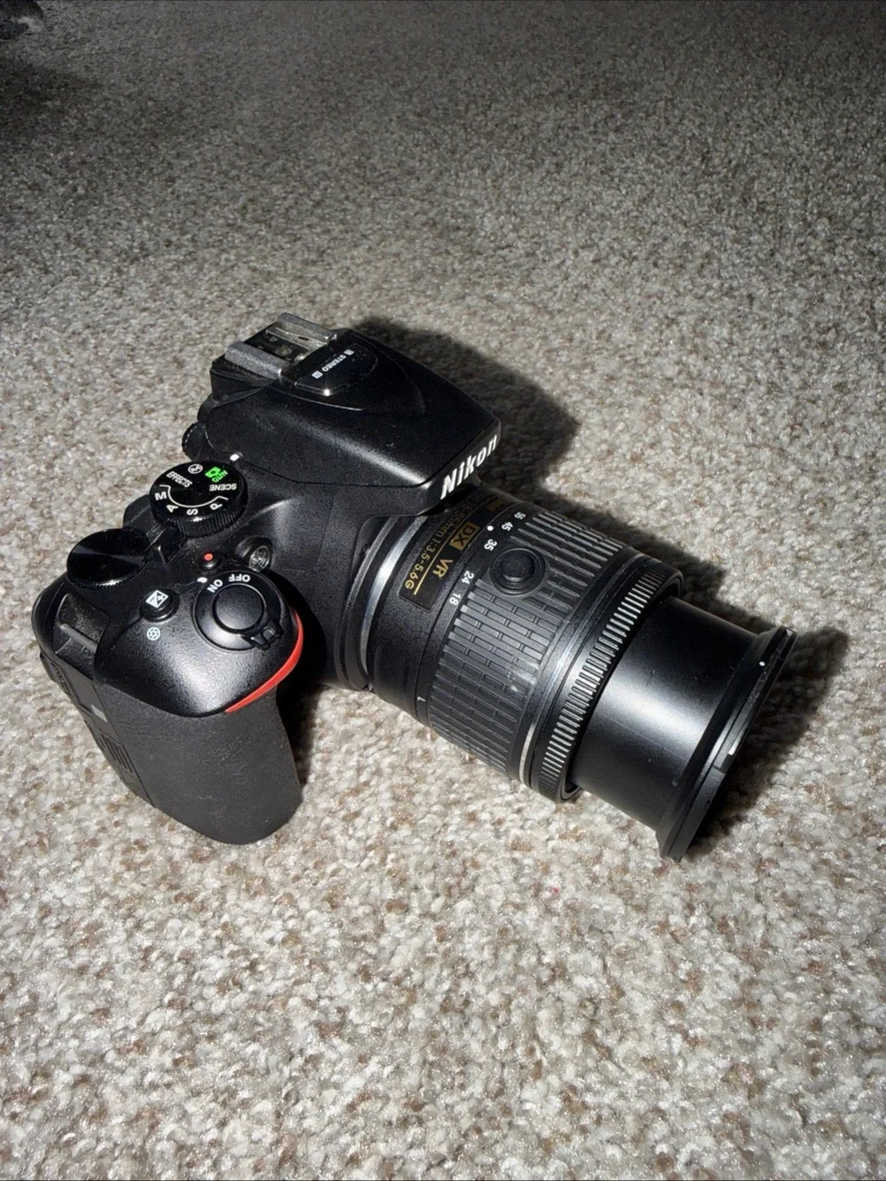 Nikon Black D5600 camera with lens and battery, battery charger